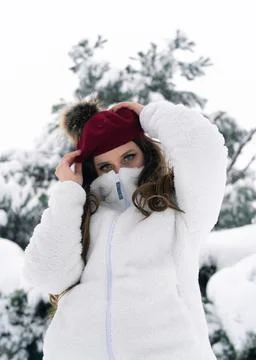 Young beautiful model posing in winter forest. stylish fashion portrait weari Stock Photos