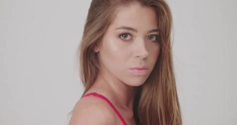 Young beautiful model showing her back of fuchsia dress, portrait, long look Stock Footage 138504488