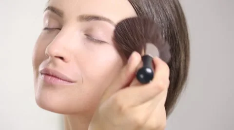 Young beautiful perfect model applying professional makeup Stock Footage 65214548