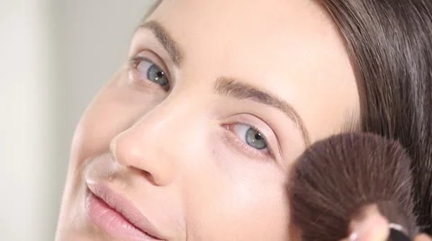 Young beautiful perfect model applying professional makeup Stock Footage 65231392