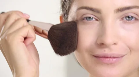 Young beautiful perfect model applying professional makeup Stock Footage 65231932