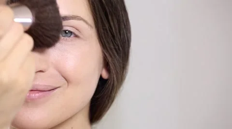 Young beautiful perfect model applying professional makeup Stock Footage 65232371