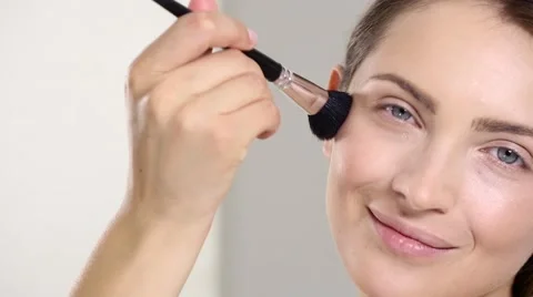 Young beautiful perfect model applying professional makeup Stock Footage 65234053