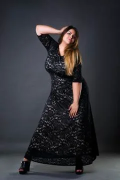 Young beautiful plus size model in black dres, xxl woman Stock Photos