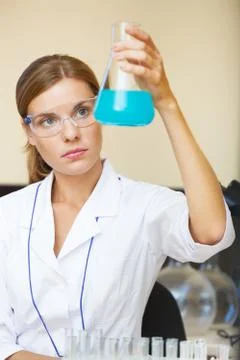 Young beautiful scientist working with samples in lab. Stock Photos