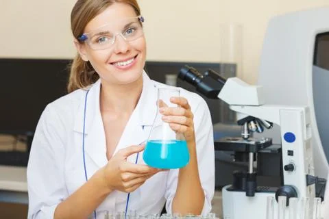 Young beautiful scientist working with samples in lab. Stock Photos