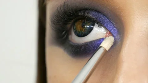 Young beautiful sexy girl models make blue evening make up smoky eyes and with Stock Footage