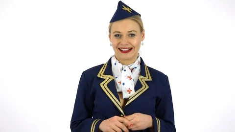 A young beautiful stewardess talks to the camera with a smile - white screen Stock-Footage 90485009