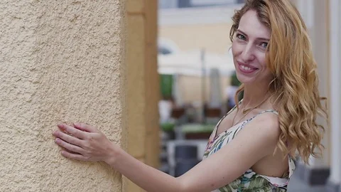 Young beautiful stylish girl posing at the summer city streets on a Sunny day. Stock Footage 80331595