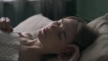 Young beautiful waking up in her bed fully rested Stock Footage 85986063
