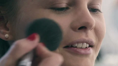 Young beautiful  woman applying make-up by make-up artist. brush Painting Stock Footage 59597957