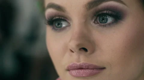 Young beautiful  woman applying make-up Stock Footage 59604682