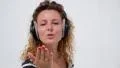 Young Beautiful Woman in Bright Sun Enjoying Music in Headphones. HD Footage