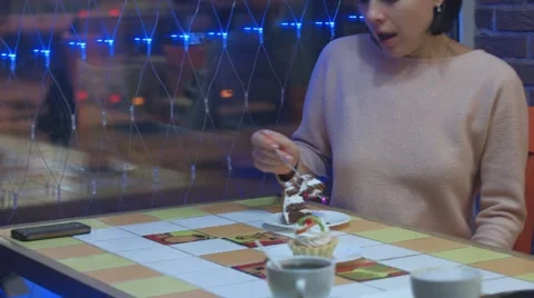 Young beautiful woman eating a dessert Stock Footage 59086728