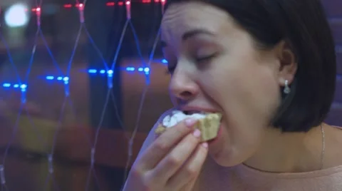 Young beautiful woman eating a dessert Stock-Footage 59088158