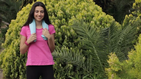 Young beautiful woman having fun after sport outdoors Stock Footage 33905053