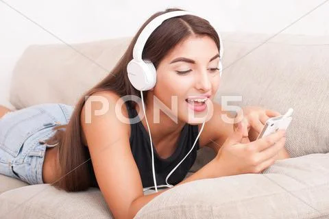 Young beautiful woman in headphones Stock Photos
