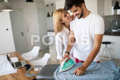 Young beautiful woman hugging her attractive boyfriend Stock Photos