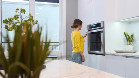 Young beautiful woman in the kitchen Stock Footage 116790053