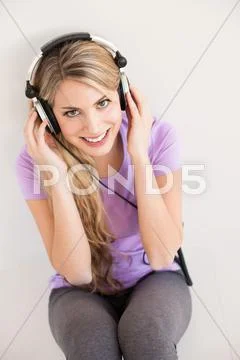 Young Beautiful Woman Listen Music With Headphones