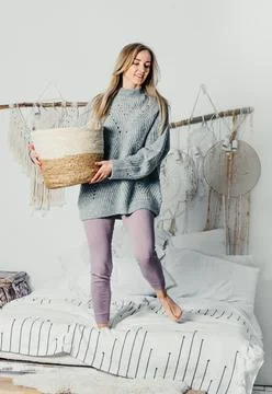Young beautiful woman model long hair insweater christmas tree christmas light Stock Photos