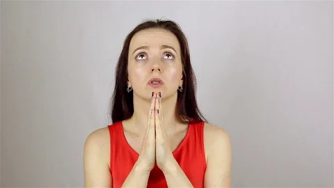A young beautiful woman prays, asking God for help. Stock Footage 77581753