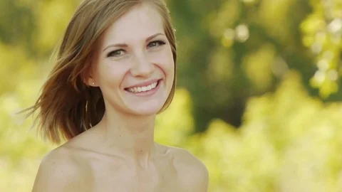 Young beautiful woman puts lipstick on lips Stock Footage