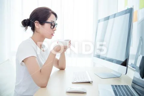 Young beautiful woman resting in the office Stock Photos