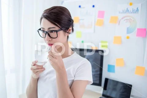 Young beautiful woman resting in the office Stock Photos