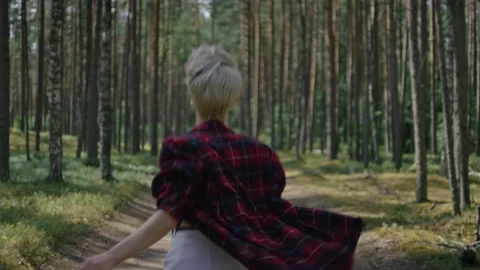 Young beautiful woman run in forest,look at camera Stock Footage 162559953