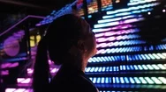 Young Beautiful Woman Standing Beside Neon Rgb Lights, Nightlife. Young Woman Ta Stock Footage