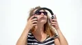 Young Beautiful Woman in Sunglasses Enjoying Music. Slow Motion. HD Footage