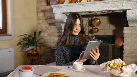 Young beautiful woman using tablet during having breakfast 4k Stock Footage 87698936