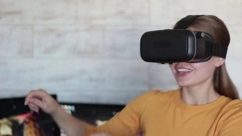 Young beautiful woman using vr headset Stock Footage 70718491