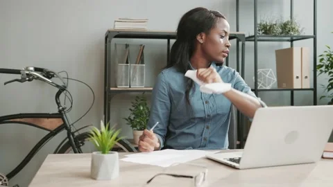 Young beautiful woman working in modern office and brainstorming herself writing Stock Footage 148242580