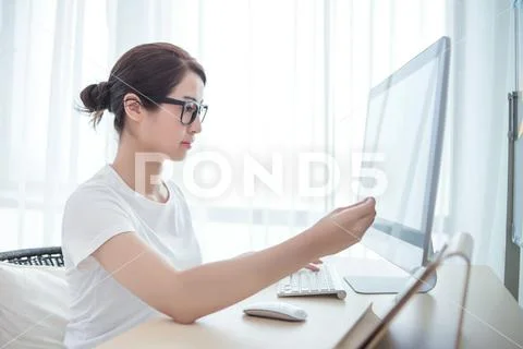 Young beautiful woman working in the office Stock Photos