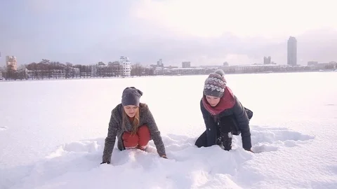 Young beautiful womans playing with snow 库存影片 124632011