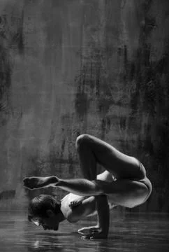 Young beautiful yoga instructor is posing in studio. Stock Photos