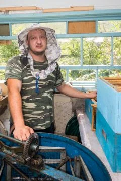 A young beekeeper on an apiary. Stock Photos