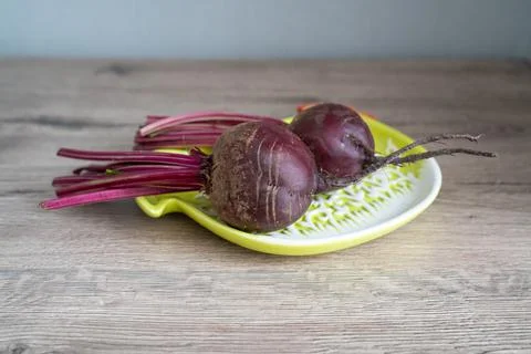 Young beetroot on the chicken shaped plate Stock Photos