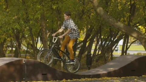 Young biker on the pump track Stock Footage 145252467