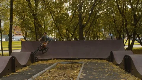 Young biker on the pump track Stock Footage 145306844