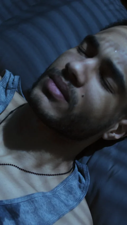 Young Biracial Man Having Panic Attack in Bed at Nighttime Stock Footage 284526885