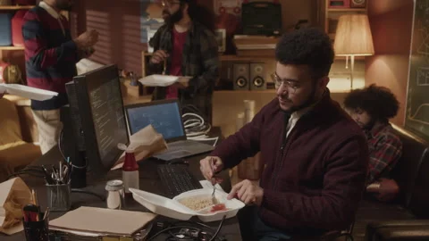 Young Biracial Programmer Having Lunch with Colleagues in Handmade Office Stock Footage 263307403