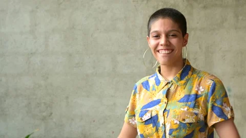Young bisexual with the flag of diversity in his hands and very smiling. Video stock 155855851