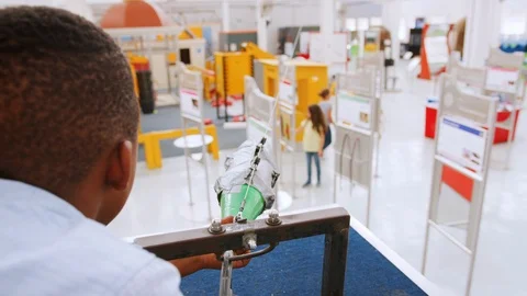 Young black boy using air pressure rocket at science centre Stock Footage 95501229