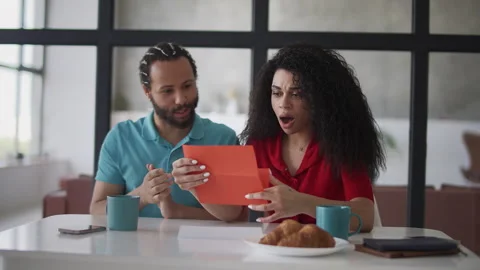 Young Black couple reading a final notice letter, shocked by financial problems Stock Footage 333781563