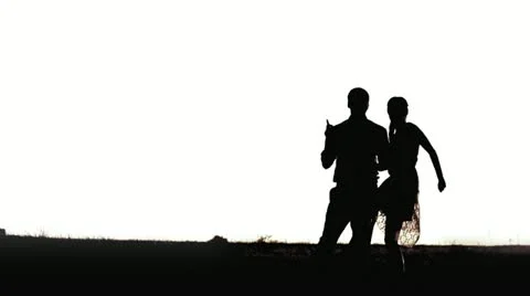 Young black couple silhouettes dancing isolated on white background Stock Footage 11701558