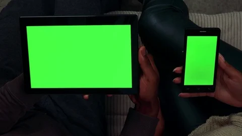 Young black couple work on smartphone and tablet in living room - closeup Stock-Footage 82227546