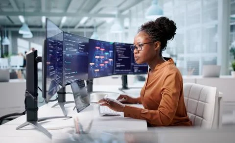 Young Black Engineer Developing Code For Web On Desktop Computer Stockfoto's